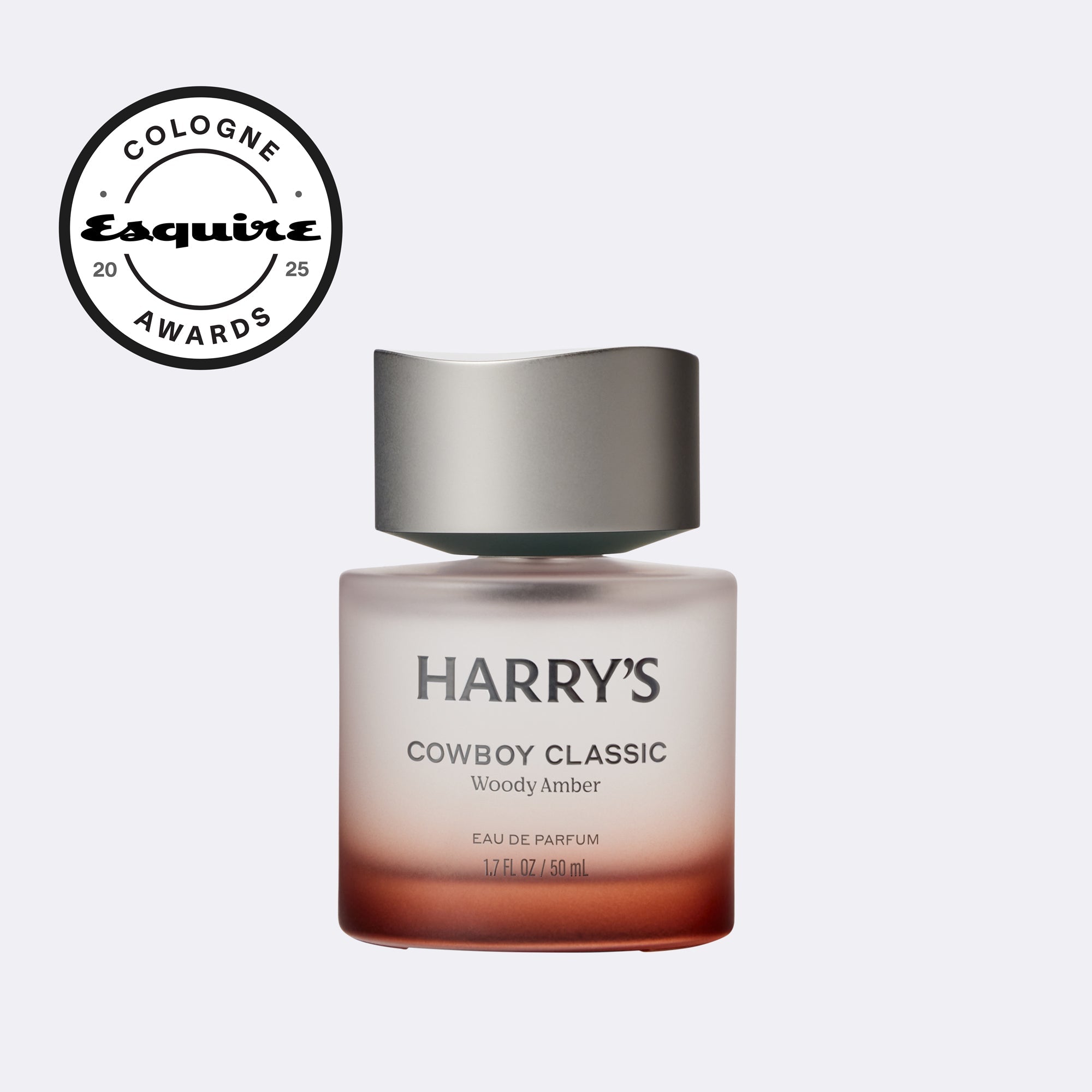 Harry's Cowboy Classic Woody Amber perfume bottle with 'Cologne Awards' logo on a light gray background
